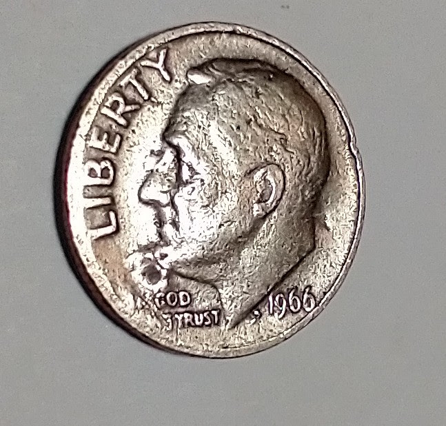 Looking-For-Thoughts-On-The-Curious-Surface-On-This-1966-Roosevelt-Dime